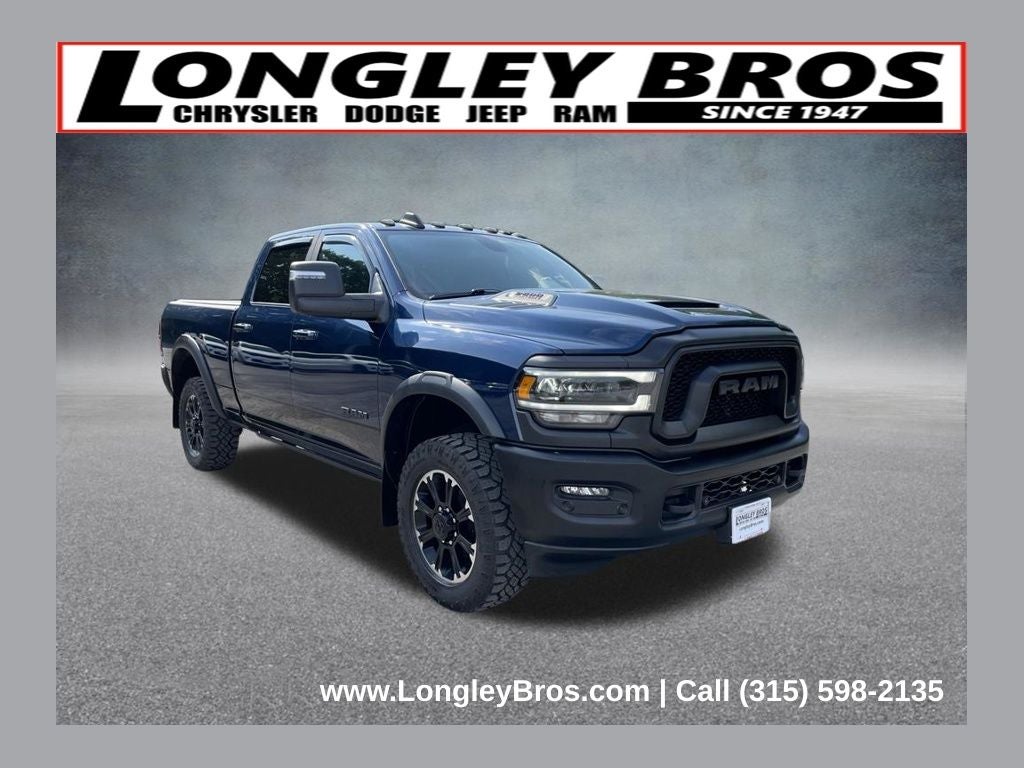2024 RAM 2500 Rebel in Patriot Blue Pearlcoat — front three-quarter view